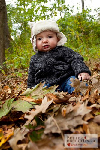 Family Portrait - Baby seated in Fall leaves