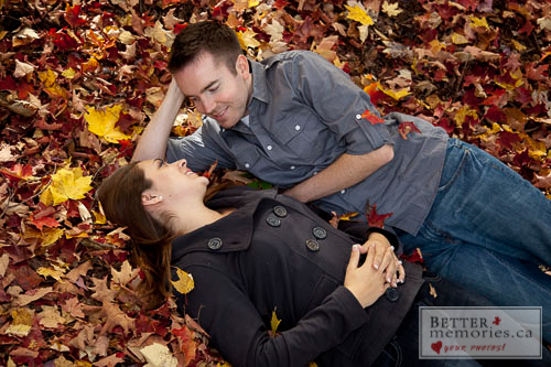 Picture of Couple Laying in Fall Leaves